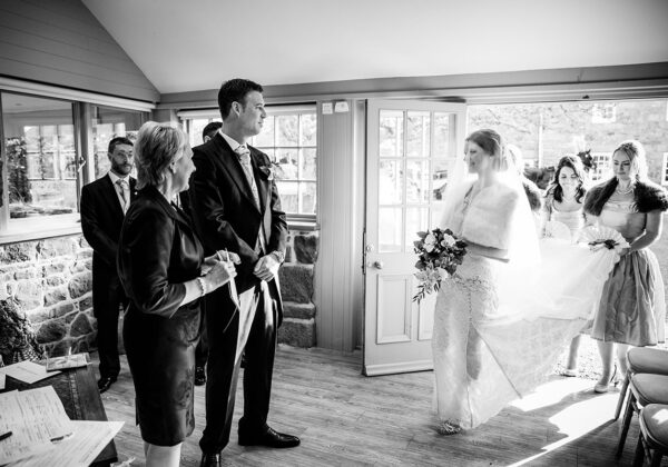 Bride and groom getting married in there garden room at La Mare Wine Estate